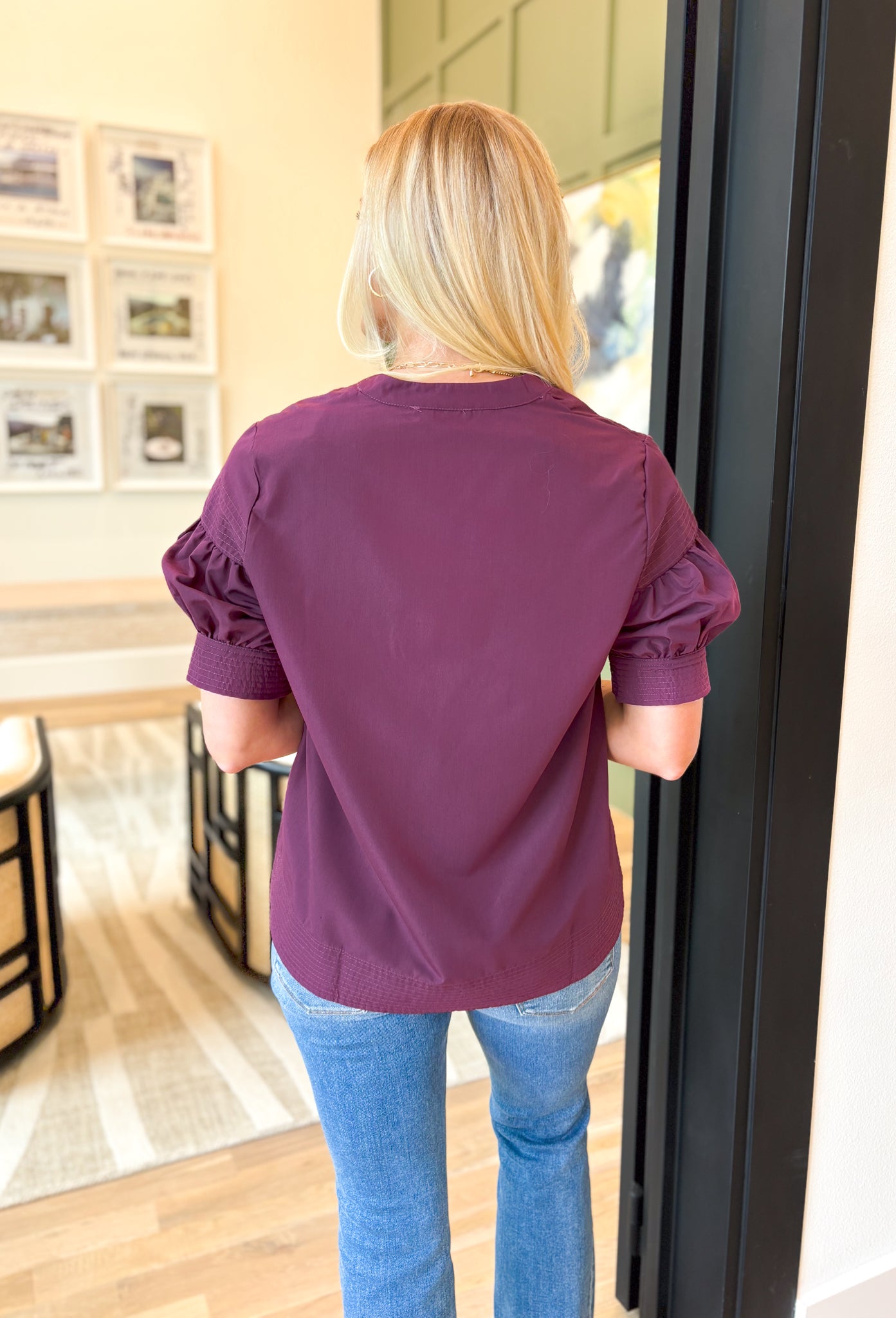 Tell Me The Truth Top, short sleeve blouse in a deep plum, stitch details on the sleeves and bottom of the blouse, v-neckline 