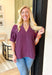 Tell Me The Truth Top, short sleeve blouse in a deep plum, stitch details on the sleeves and bottom of the blouse, v-neckline 