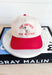 The Dirtier The Better Trucker Hat, red and cream trucker hat with red embroidered text "the dirtier the better" with a hand holding a martini in the center 