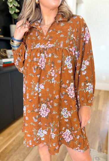 The Only Reason Floral Dress, burnt orange floral corduroy long sleeve mini dress with v-neck line and collar, floral print is light pink, bubblegum pink, sage, white and hints of light blue 