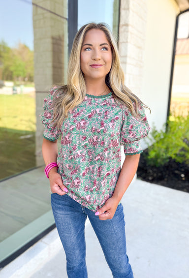 Too Good To Me Top, forest green, light pink, and deep magenta short sleeve blouse with forest green scalloped lace trim on the neck and sleeve hem  