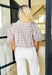 Trust Yourself Top, taupe, light blue, and white plaid puff sleeve blouse with ruffling on the shoulder and a v-neck line 