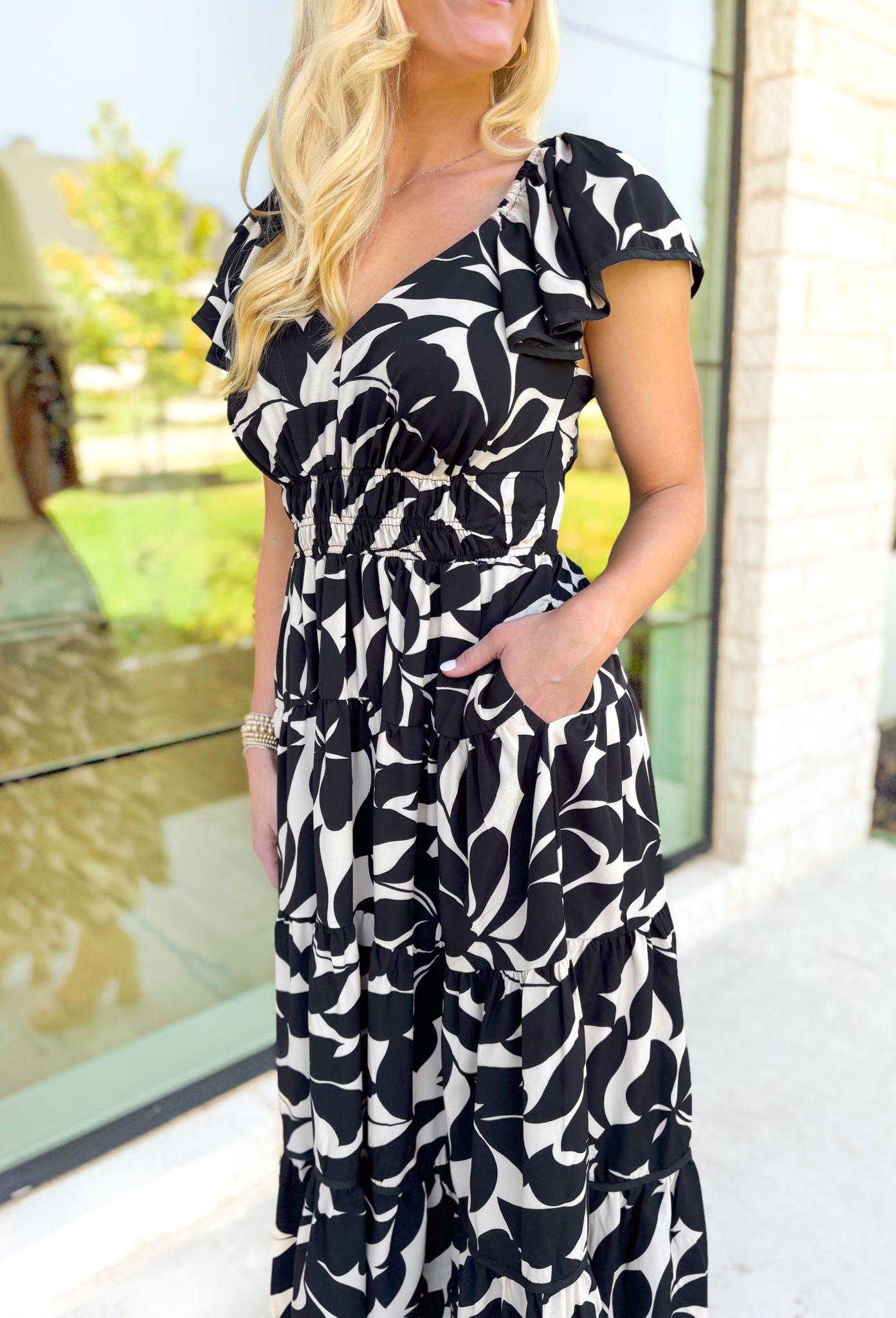 Wishing For More Midi Dress, ruffle sleeve soft v-neck cinched waist tiered midi dress in a black and off white floral print