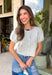 Meet the cardigan you'll be reaching for all season long! This heather grey knit is the definition of timeless style, combining a classic button-down silhouette with soft puff sleeves for a feminine touch. The cozy sweater knit feels warm without being bulky, making it perfect for layering through the fall months. Whether you're heading to the office, meeting friends for coffee, or relaxing on the weekend, this versatile cardigan is an effortless staple you'll wear year after year.