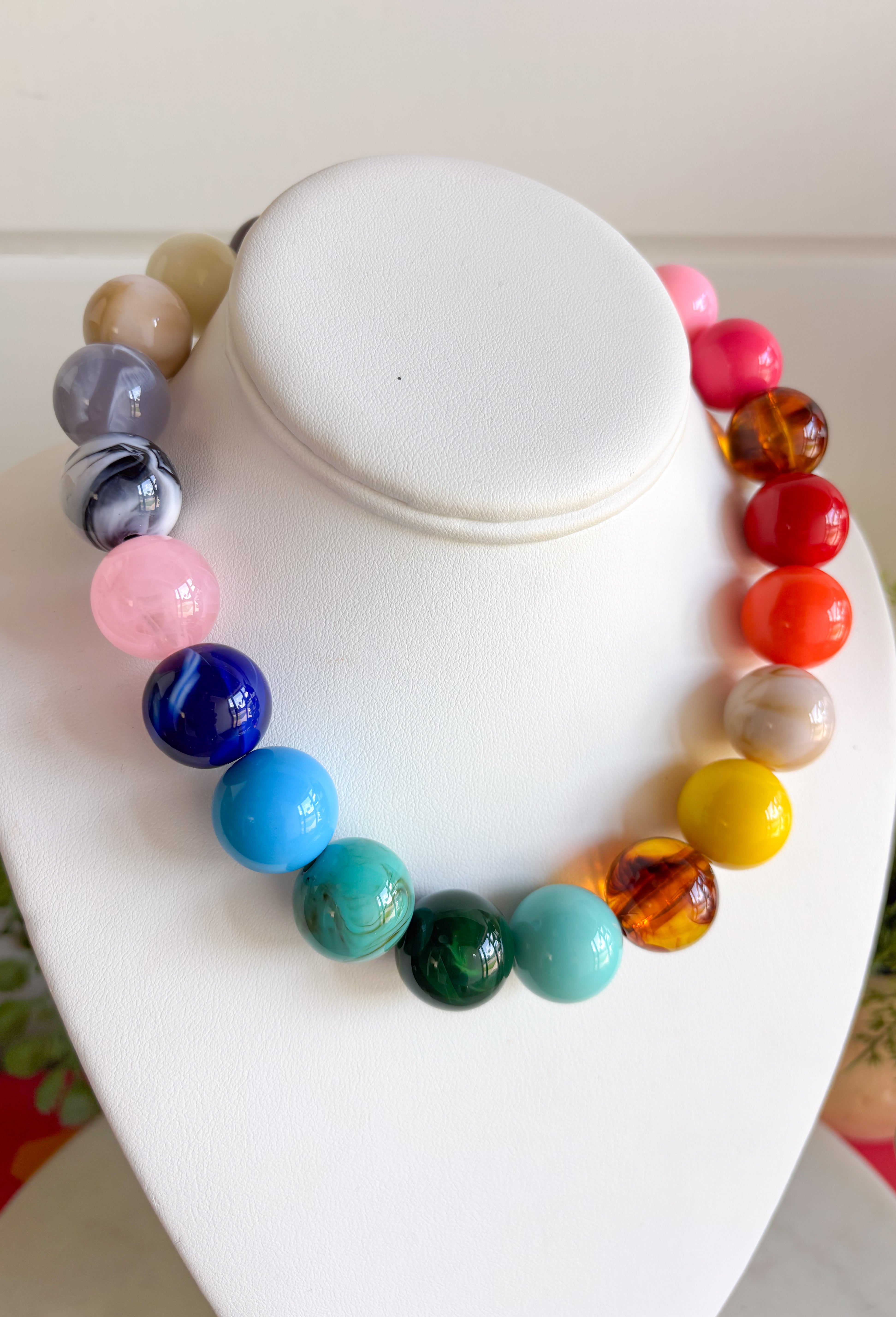 Bring on the sunshine and color! This chunky beaded necklace is the ultimate summer statement piece. Featuring a vibrant mix of colorful beads, it instantly adds a fun, playful touch to any outfit. Whether you're styling it with a simple tank, a breezy sundress, or your favorite vacation look, this necklace does all the heavy lifting. The chunky design keeps it right on trend, while the cheerful colors make it impossible not to smile. 