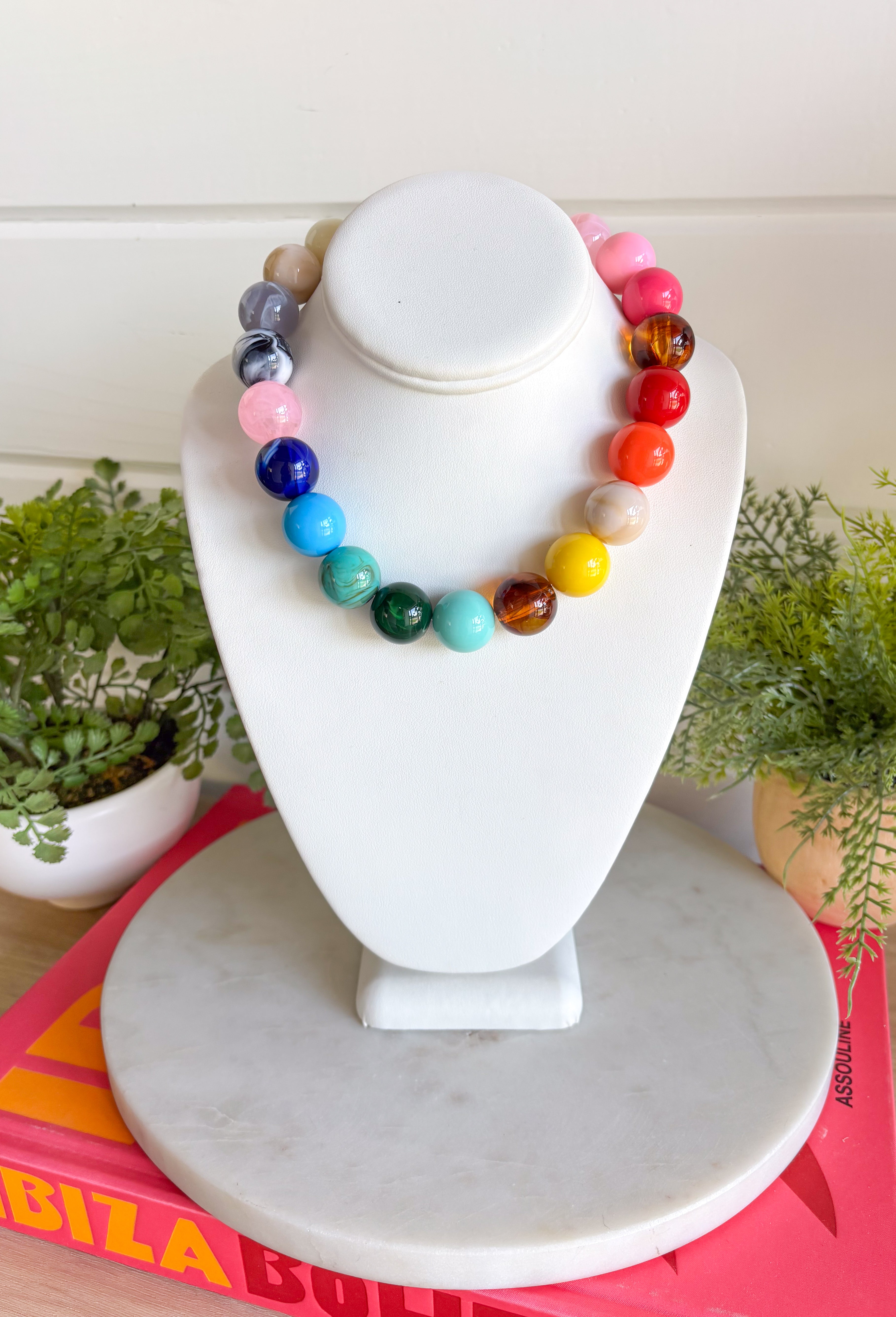 Bring on the sunshine and color! This chunky beaded necklace is the ultimate summer statement piece. Featuring a vibrant mix of colorful beads, it instantly adds a fun, playful touch to any outfit. Whether you're styling it with a simple tank, a breezy sundress, or your favorite vacation look, this necklace does all the heavy lifting. The chunky design keeps it right on trend, while the cheerful colors make it impossible not to smile. 