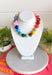 Bring on the sunshine and color! This chunky beaded necklace is the ultimate summer statement piece. Featuring a vibrant mix of colorful beads, it instantly adds a fun, playful touch to any outfit. Whether you're styling it with a simple tank, a breezy sundress, or your favorite vacation look, this necklace does all the heavy lifting. The chunky design keeps it right on trend, while the cheerful colors make it impossible not to smile. 