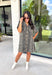 Classic denim meets a timeless animal print in this effortlessly stylish dress. This neutral leopard print denim dress is the perfect balance of bold and versatile. The button-front design and short sleeves give it an easy, everyday feel, while the front patch pockets and side pockets add both charm and function. Crafted from a soft cotton blend with just the right amount of stretch, this dress is made for everything from casual weekends to lunch dates and fall adventures.