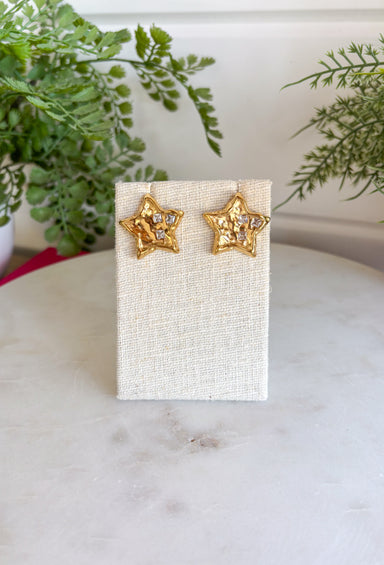 Bring a little sparkle and timeless charm to your jewelry collection with these dazzling star stud earrings. Crafted in a classic gold finish, each petite star is adorned with shimmering crystal accents that beautifully catch the light from every angle. Their classic design makes them perfect for everyday wear while adding just the right amount of shine to special occasions. Lightweight, comfortable, and endlessly versatile, these earrings are a must-have accessory you'll reach for again and again.
