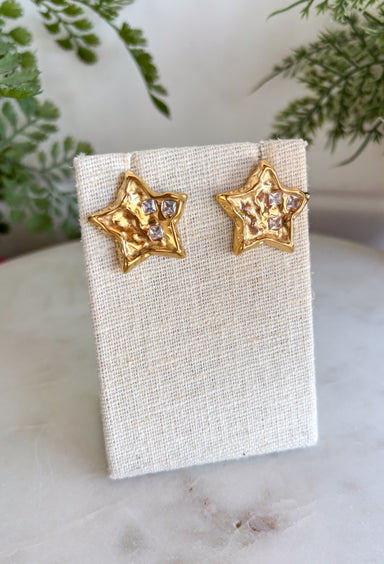 Bring a little sparkle and timeless charm to your jewelry collection with these dazzling star stud earrings. Crafted in a classic gold finish, each petite star is adorned with shimmering crystal accents that beautifully catch the light from every angle. Their classic design makes them perfect for everyday wear while adding just the right amount of shine to special occasions. Lightweight, comfortable, and endlessly versatile, these earrings are a must-have accessory you'll reach for again and again.