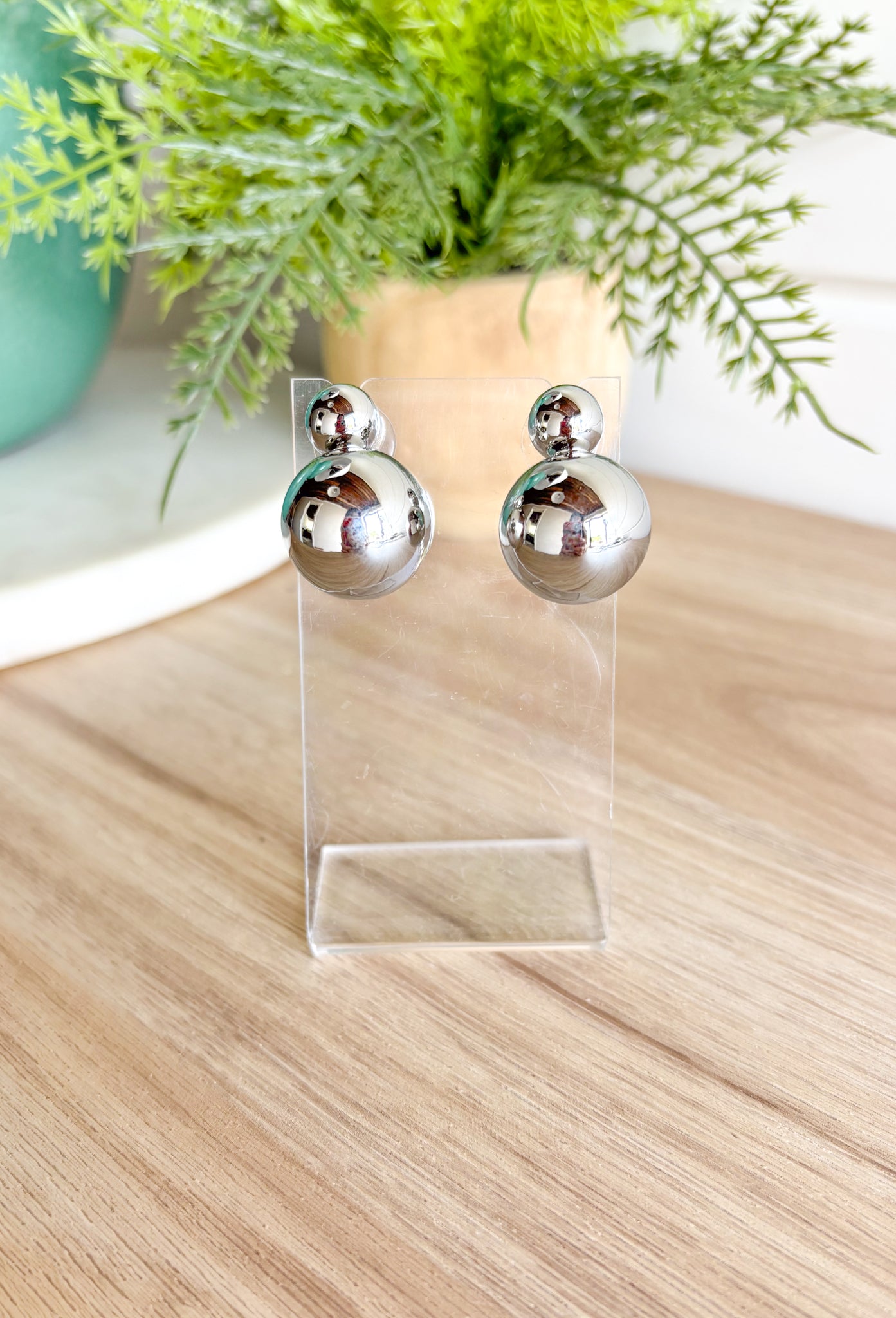 Bad Habit Earrings in Silver, stacked silver spheres top one is smaller than the bottom one 