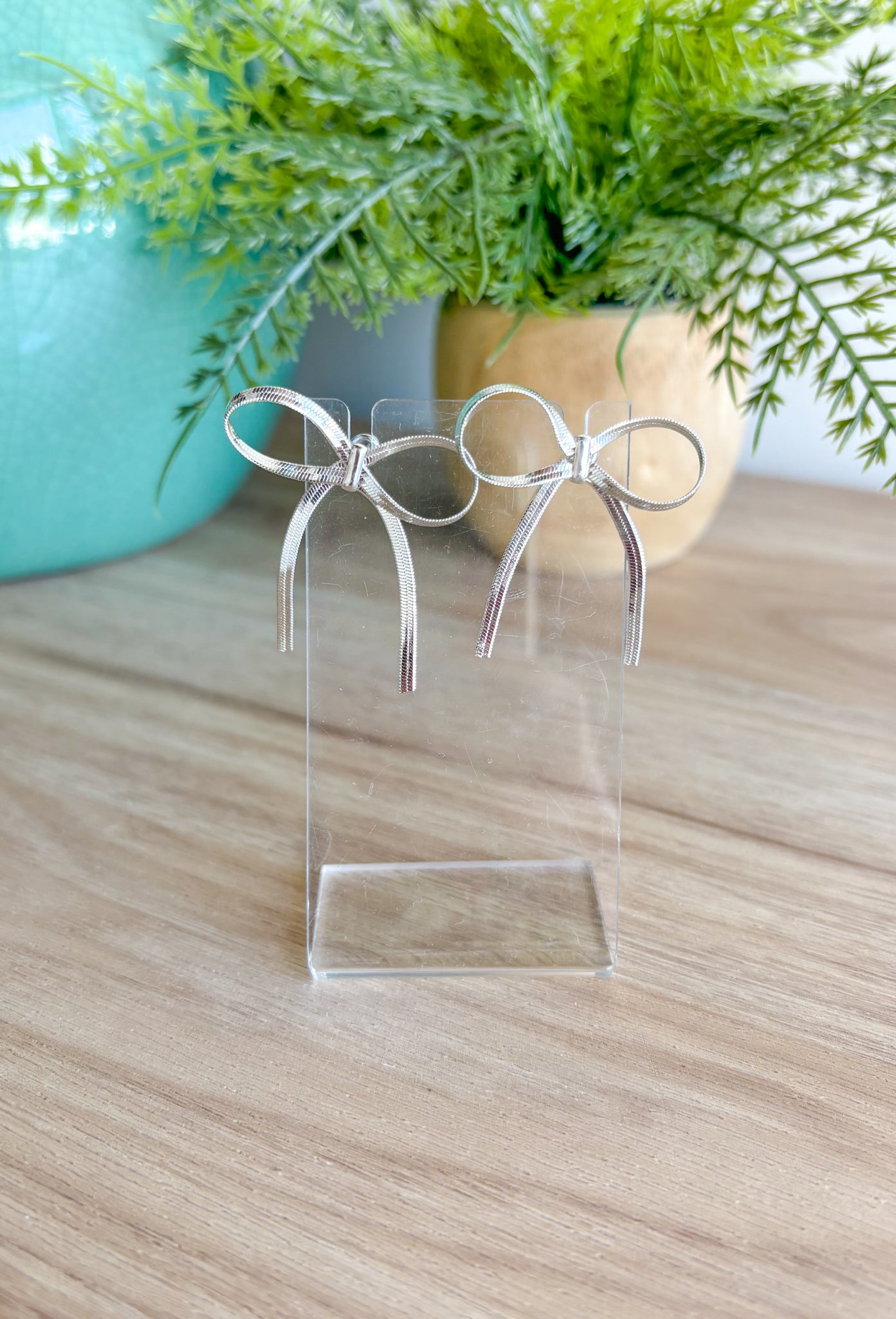 For The Record Earrings in Silver, dainty silver bow post back earrings