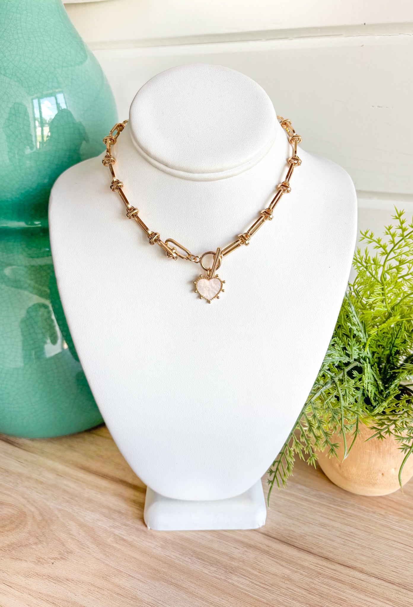 Need You Back Necklace, chunky gold paper clip and knot styled chain with white heart charm 