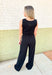 Z SUPPLY Layover Modal Fleece Jumpsuit, black sleeveless fleece jumpsuit with scoop neck line, drawstring waist and pockets 